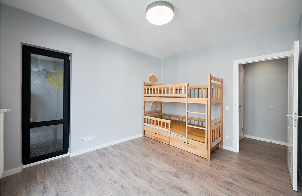 Comparison of children room with wooden bunk bed before and after restoration. Old apartment room with brick wall and new renovated flat with parquet floor and kid house bed.